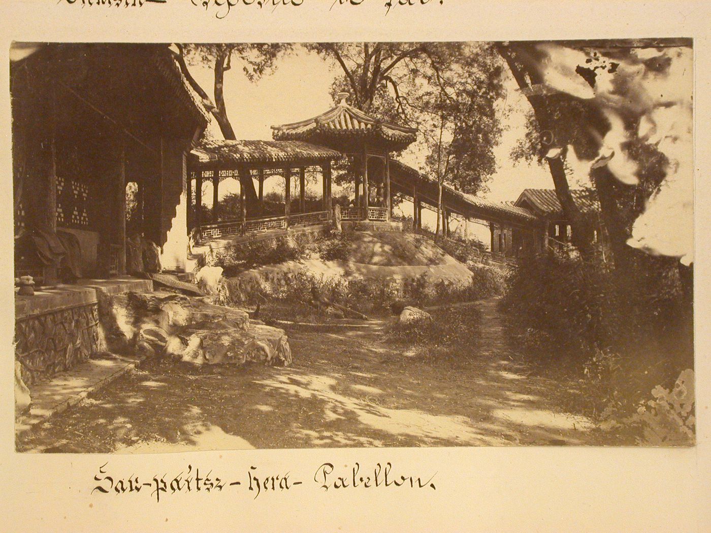 View of a covered walkway in a garden, near Peking (now Beijing), China