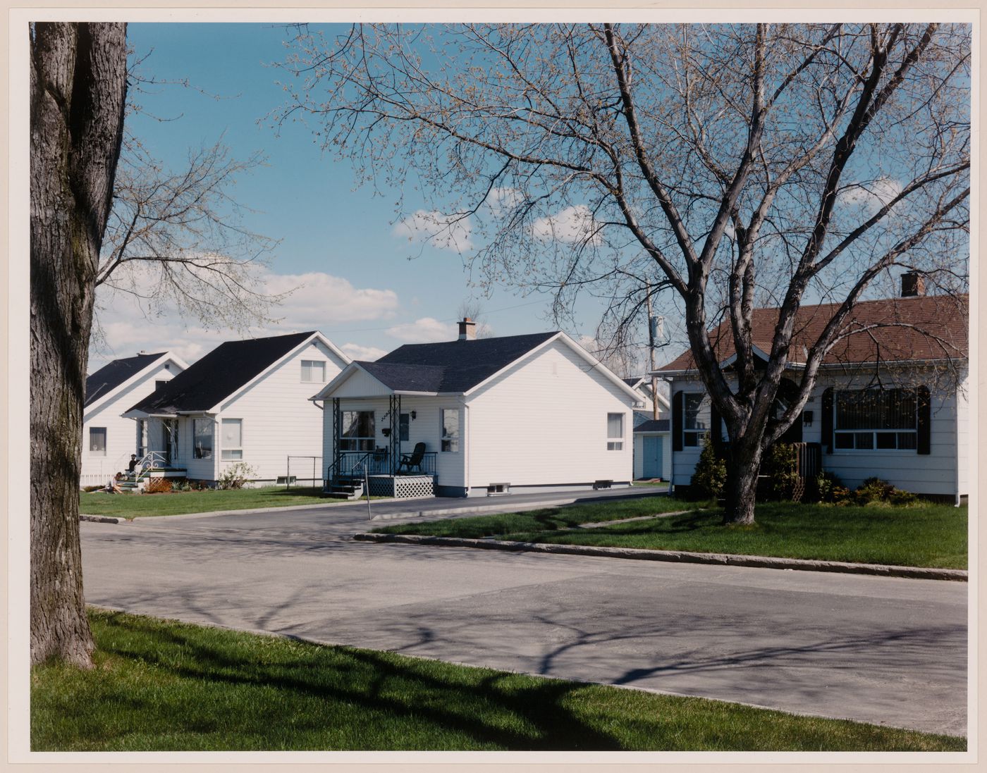 Section 2 of 2 of Panorama of workers' housing built by Wartime Housing Limited, 1941-46 rue Lamarche at rue Poitras looking northwest, Arvida, Quebec
