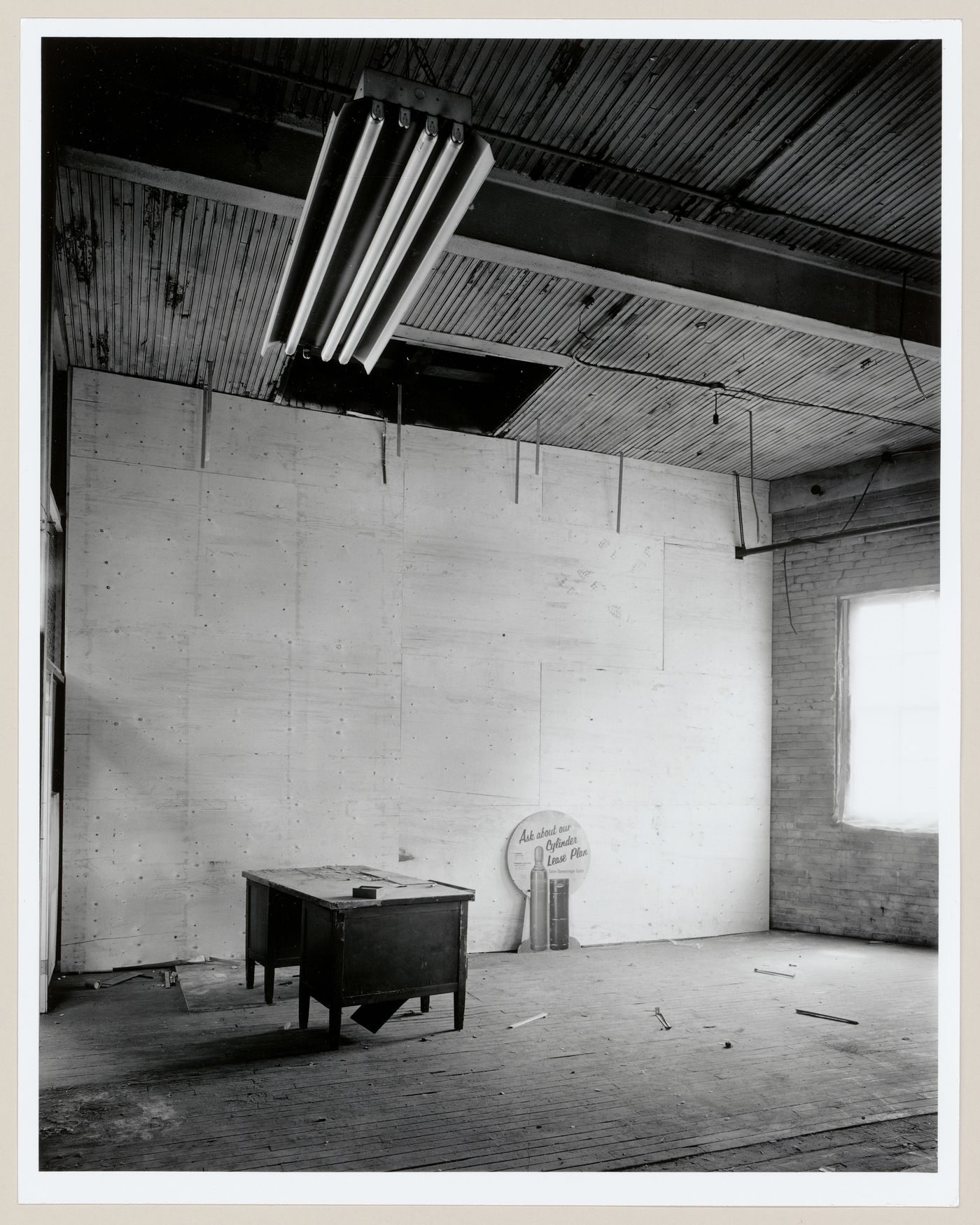 Interior view of the Caledonian Ironworks Building showing a desk in an empty room, Montréal, Québec