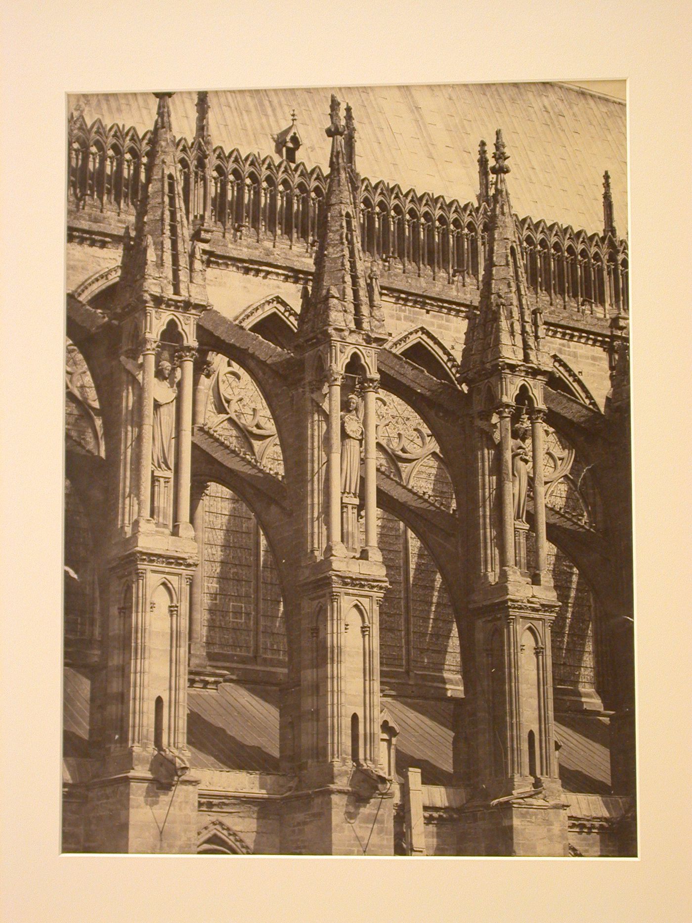 Exterior view, detail of flying buttresses supporting nave, 3 bays, Amiens, France