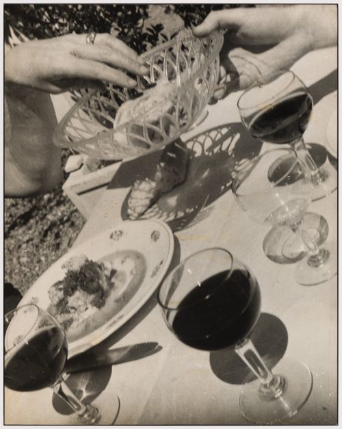 The hands of architects Arthur Erickson and Guy Desbarats during a meal in France [Pass the Bread, Please!]