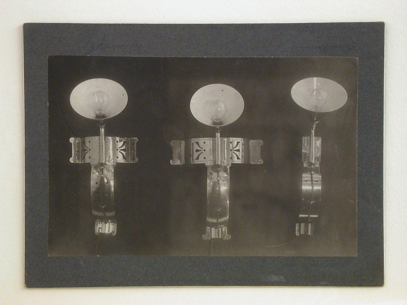 Interior view of three wall [?] lamps, Haarlem, Netherlands