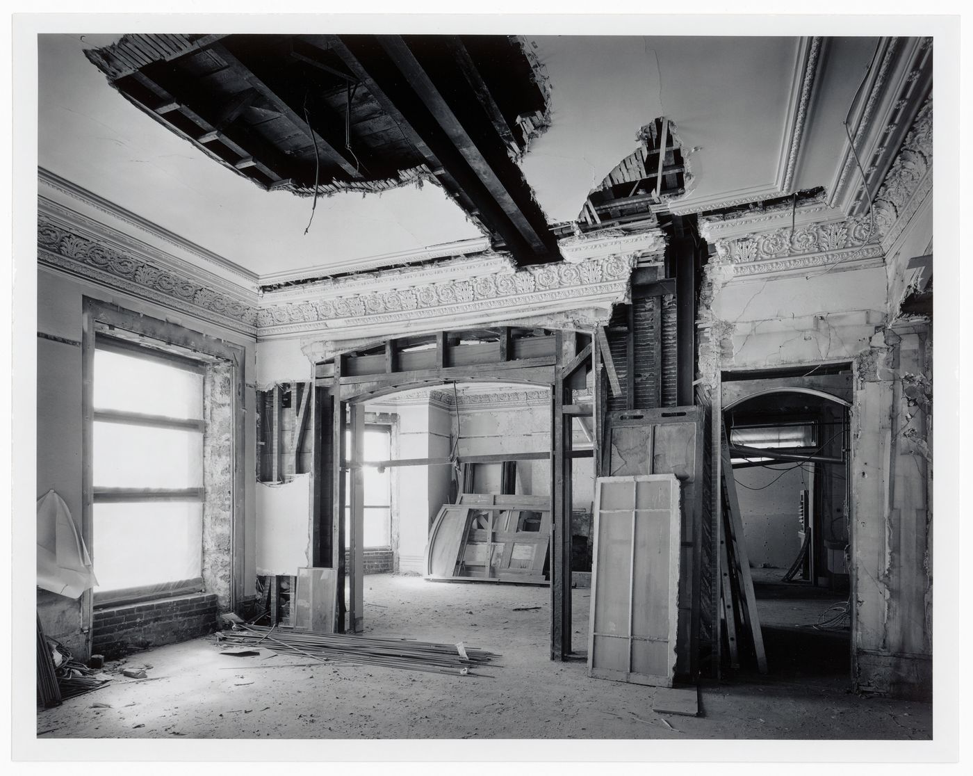 Interior view of reception rooms showing door frames and windows, Shaughnessy House under renovation, Montréal, Québec