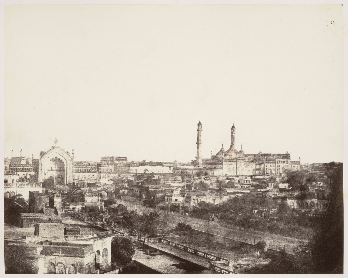 View of Lucknow, showing the west facade of the Rumi Darwaza, and the Great Imambara (also known as the Bara Imambara) in the vicinity, India