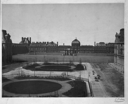 Exterior view from the east of the façade of the Tuileries, portions of the Louvre visible in the foreground, Arc du Triomphe du Carrousel visible in the distance, Paris, France