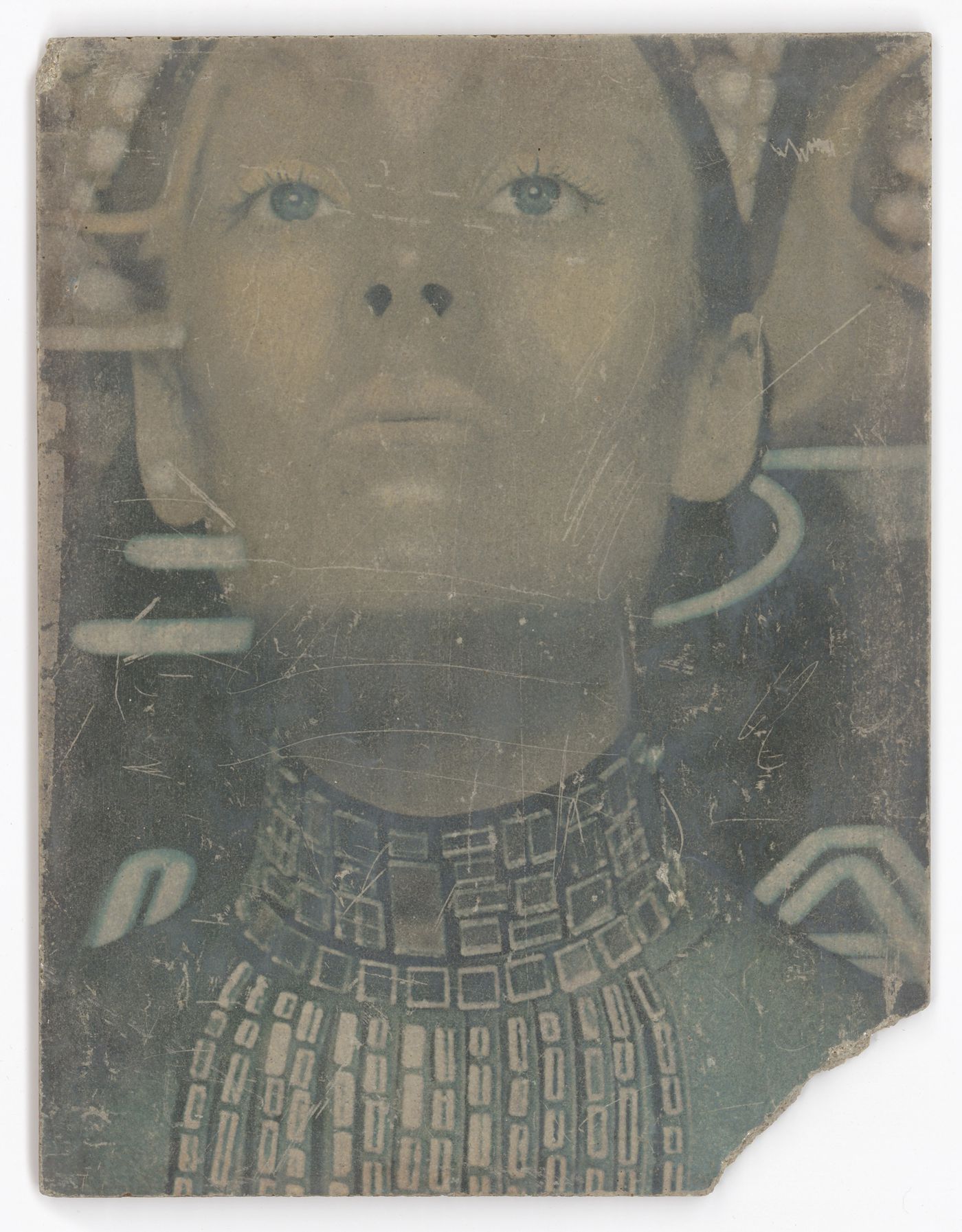 Green sulphur concrete plate with the portrait of a woman