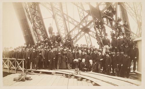 Members of the Société Centrale des Architectes on the first platform of the Eiffel Tower during its construction, Paris, France