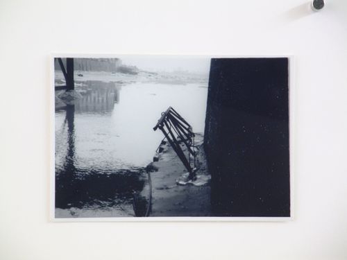 View of steel beams below bridge arch