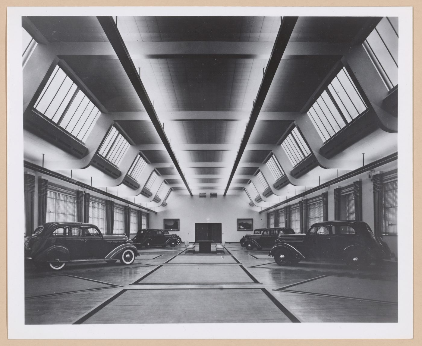 Interior view of automobiles on display in a showroom of the Engineering Building (formerly the Personnel Building), Chrysler Corporation Highland Park Plant, Highland Park, Michigan