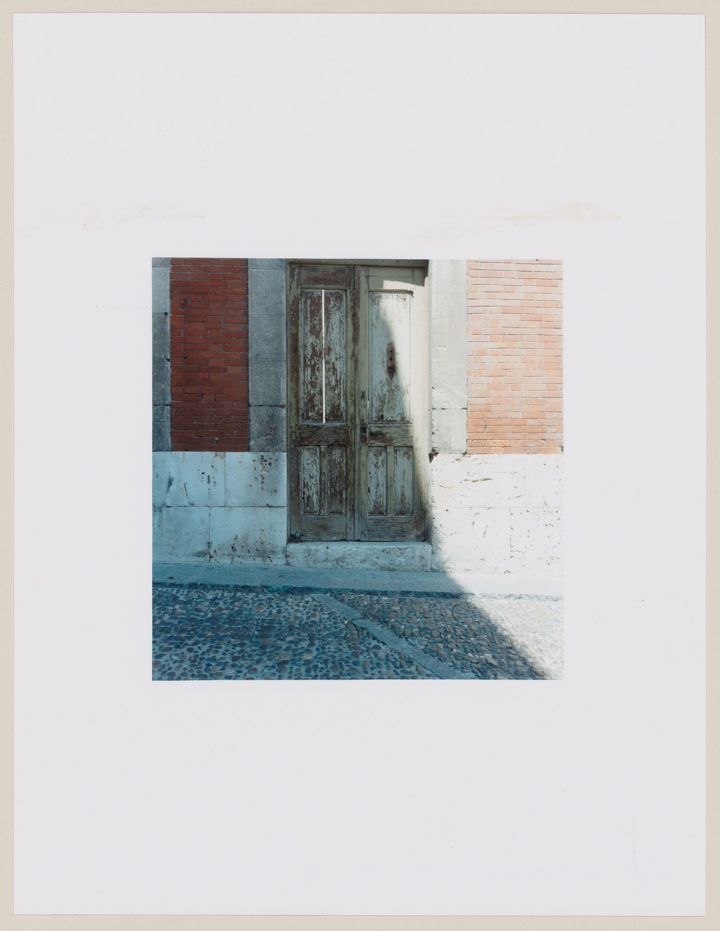 View of a doorway showing a cobbled street in the foreground, Santiago de Compostela, Spain (from the series "In between cities")