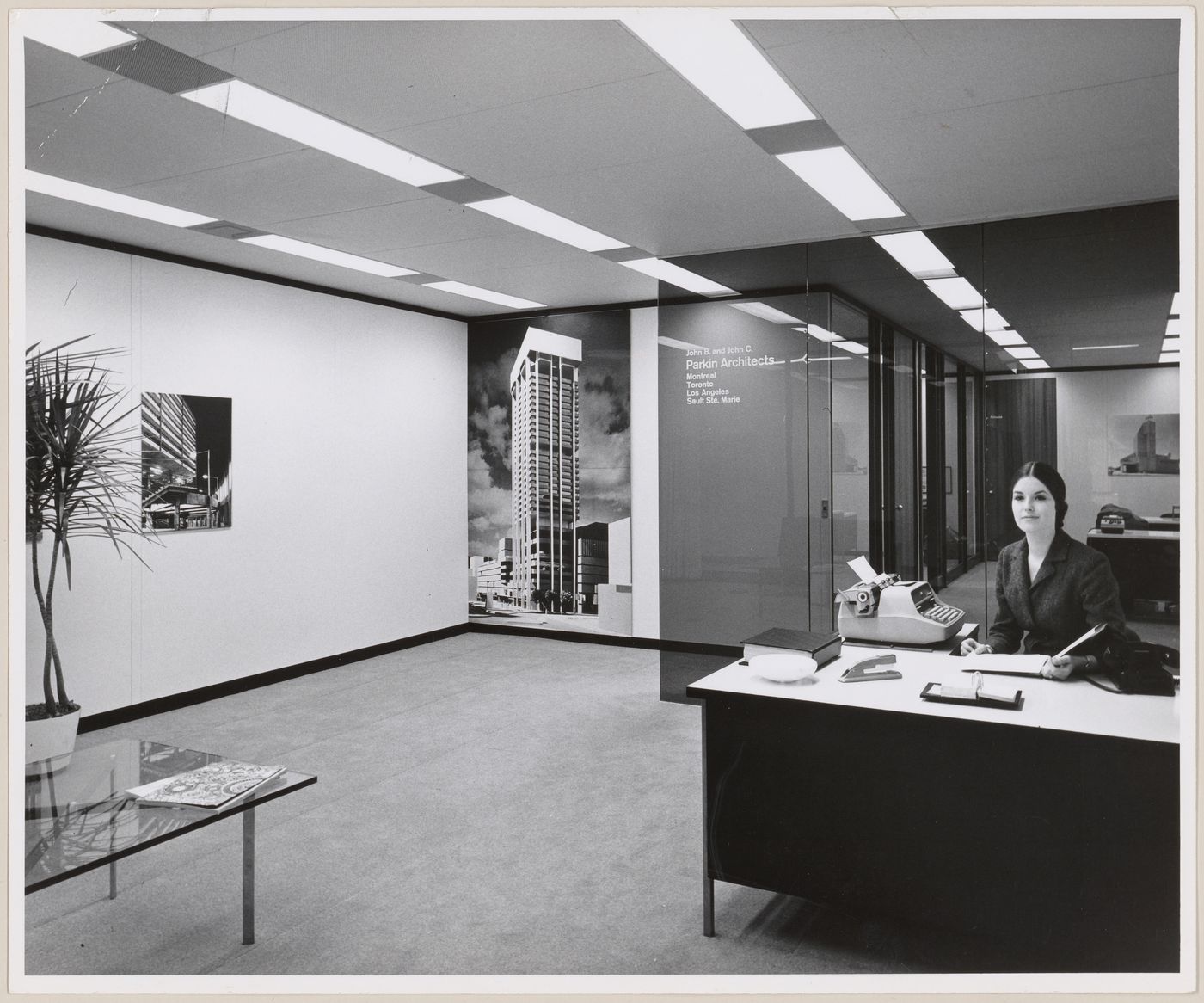Interior view of John B. Parkin Associates office with employee at desk, possibly Montreal office