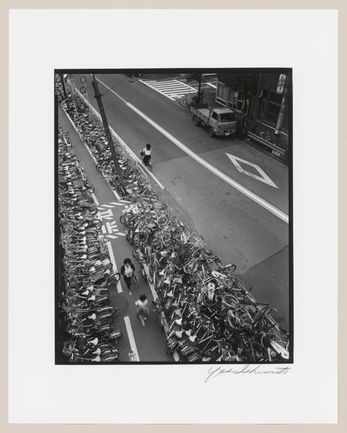 View of a street showing rows of parked bicycles, Tokyo, Japan