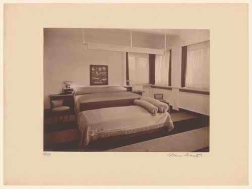 Interior view of a bedroom with one large bed, a single bed placed sideways at its foot, probably in Cologne-Marienburg, Germany