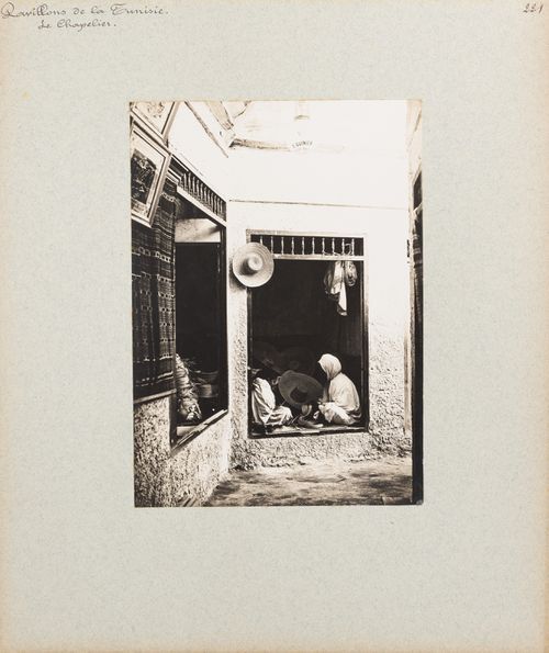 View of two women working in hat maker's shop, Tunisian section, Exposition universelle, 1900, Paris, France