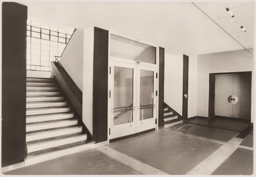 Interior view of the workshop wing of the Bauhaus building showing the vestibule doors and stairs, Dessau, Germany