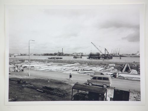 View of steel beams used for construction of power station, by river, United Kingdom