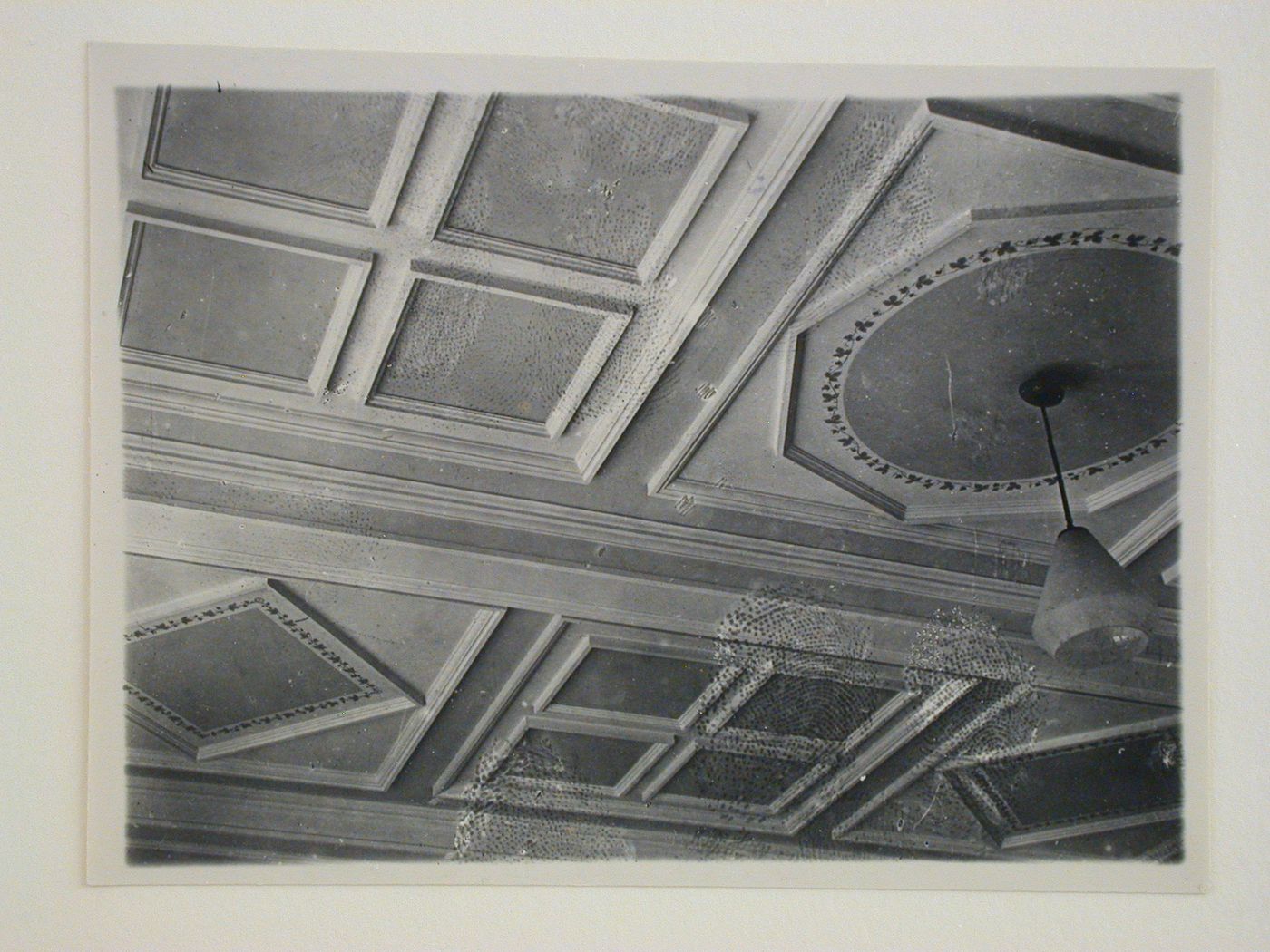 Interior view of an apartment showing a compartment ceiling and chandelier, 16 Mokhovaia Street, Moscow