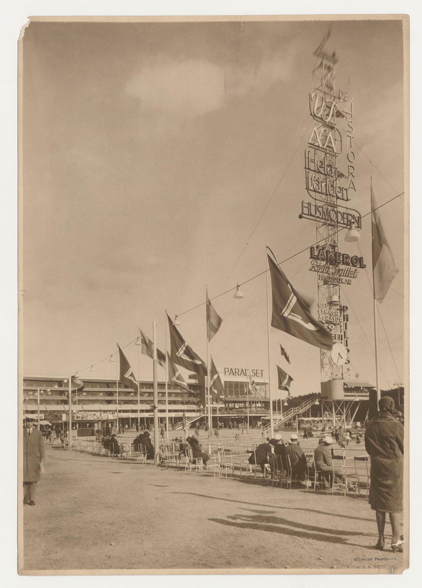 Exterior view of Paradise Restaurant, the advertising mast and the fairgrounds at the Stockholm Exhibition of 1930, Stockholm