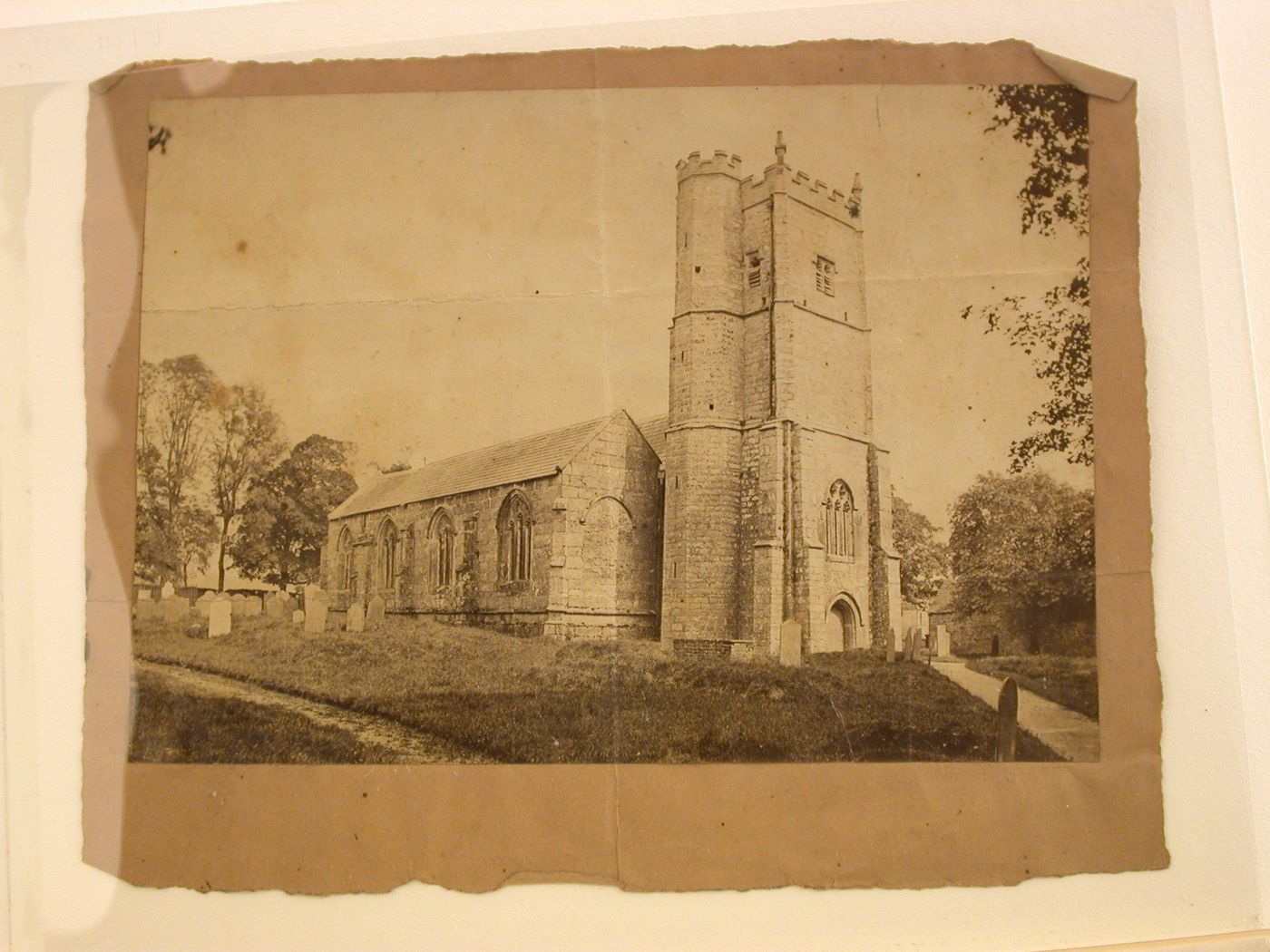 Front and side view of a church showing a cemetery, England