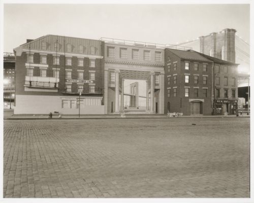 Row of buildings with unfinished mural including Brooklyn Bridge painted on the façade with Brooklyn Bridge visible behind them, New York City, New York