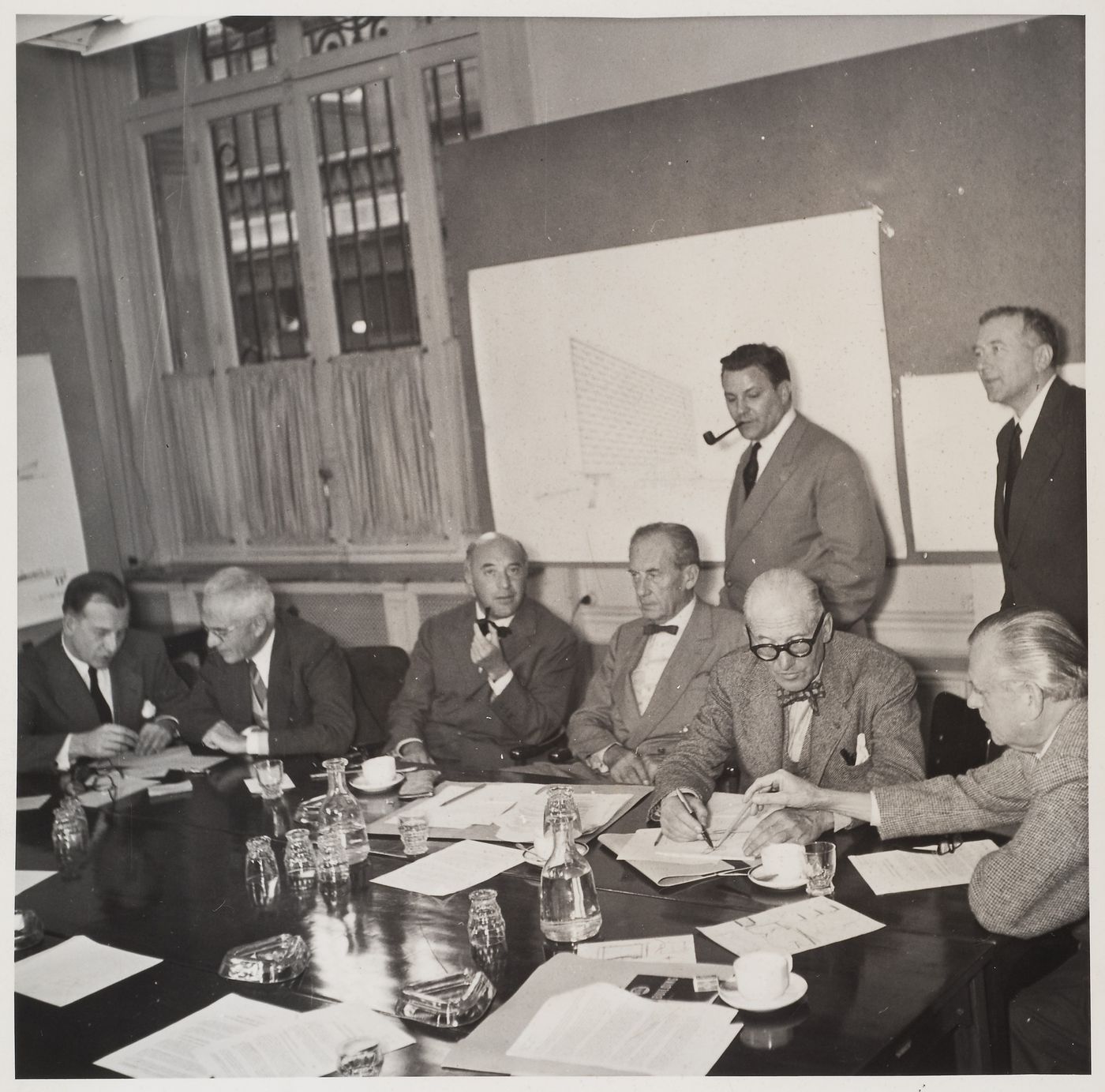 Group portrait of UNESCO architects: Eero Saarinen, Pier Luigi Nervi, Ernesto N. Rogers, Walter Gropius, Bernard Henri Zehrfuss, Le Corbusier, Marcel Breuer, and Sven Markelius, Paris [?]