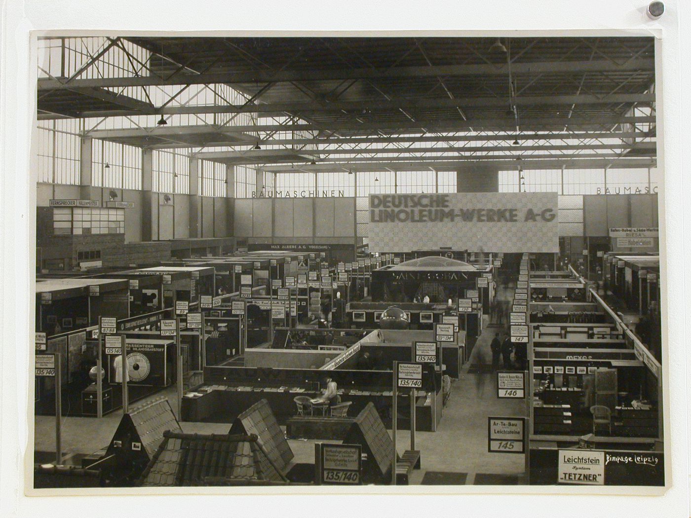 Overview of trade show linoleum exhibit booths, Leipzig [?], Germany