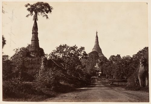 Distant view of the Shwedagon Pagoda with a stupa in the left foreground, Rangoon (now Yangon), Burma (now Myanmar)