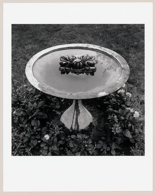 Exterior view of a fragment of an original Corinthian capital from the Head Office of the Bank of Montréal in a birdbath in Senneville, Québec