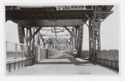 View of man riding a bicycle on the Blue Nile Road and Railway Bridge, Khartoum, Sudan