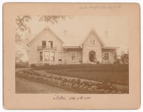 View of the principal façade of a house showing two women on the stairs, rue Milton, Montréal, Québec