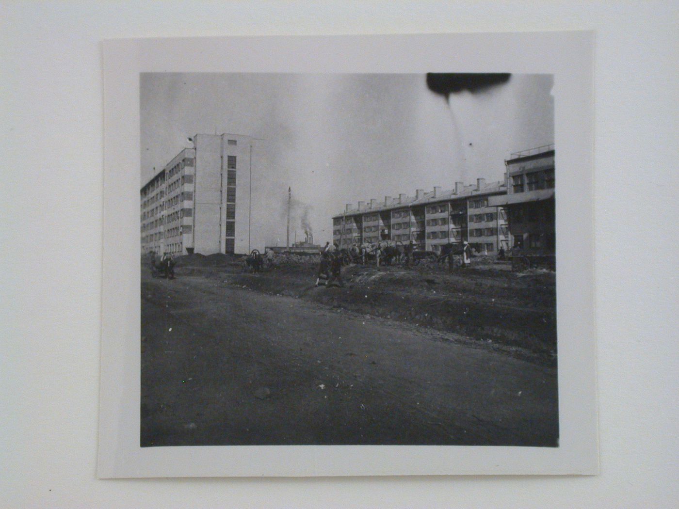 Exterior view of workers' housing with the club-cafeteria on the right, Kharkov Tractor Plant (KhTZ) Settlement, Kharkov, Soviet Union (now in Ukraine)