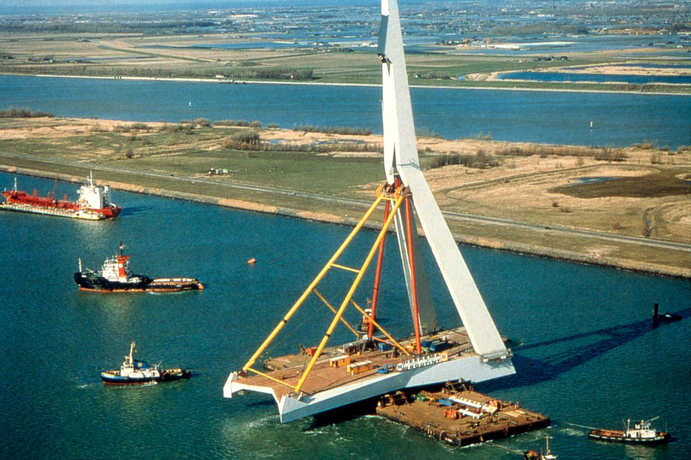 View of completed pylon being floated down the River Maas, Erasmus Bridge construction, Rotterdam