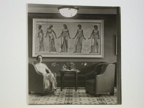 Portrait of Mrs. Hodler in the living [?] room of the Hodlers' apartment showing a painting and furnishings, 29 Quai du Montblanc, Geneva, Switzerland