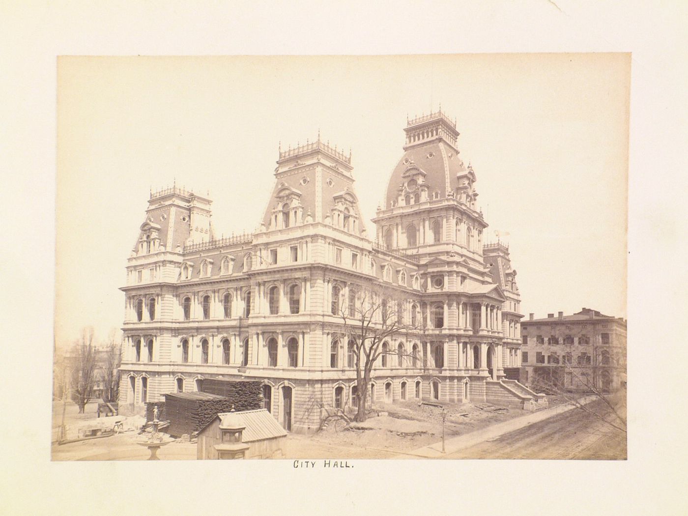 View of the Hôtel de ville showing construction materials in the foreground, 275 rue Notre-Dame Est, Montréal, Québec