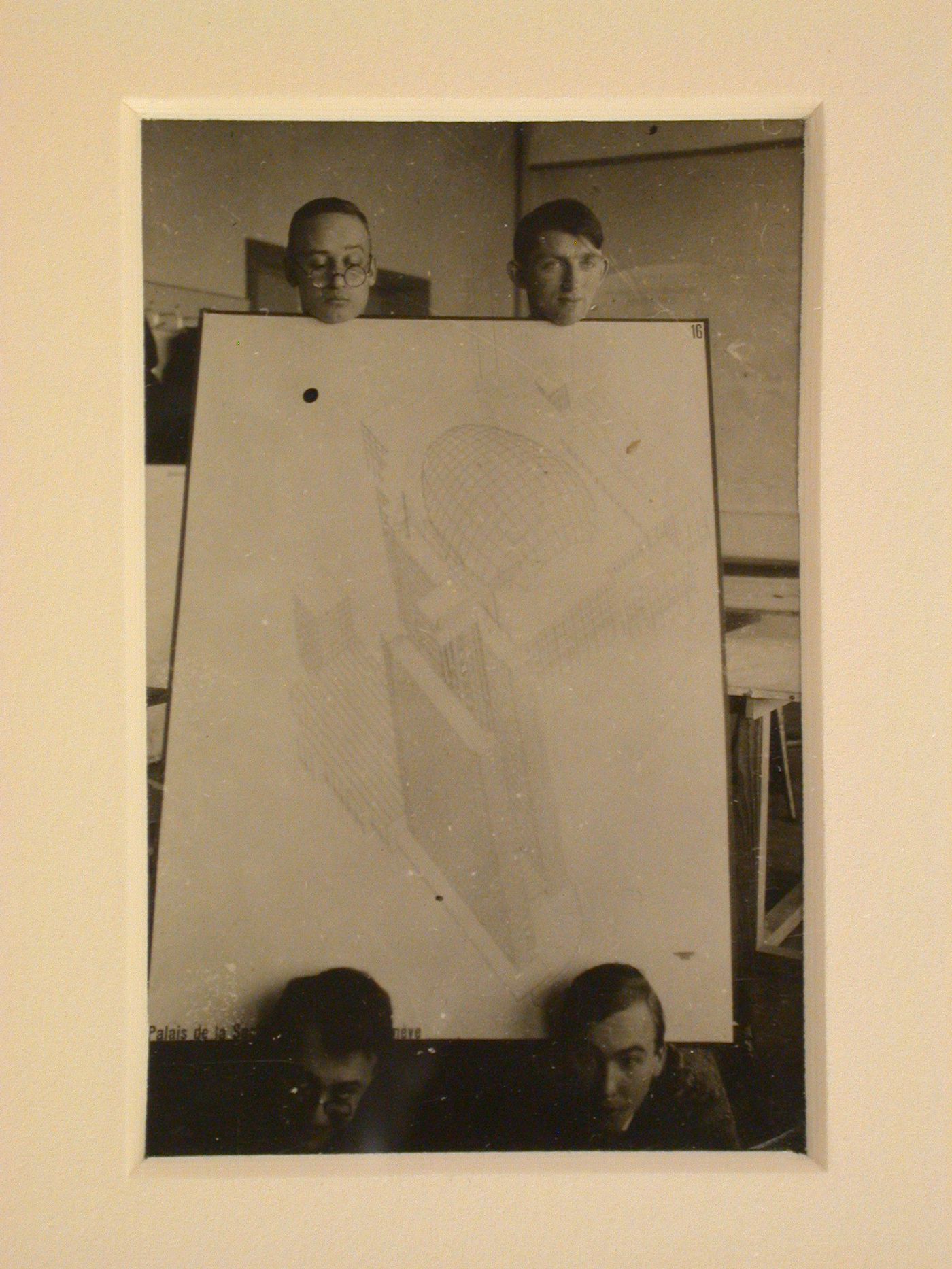 Portrait of Hannes Meyer, Aryeh Sharon and unidentified students at the Bauhaus in Dessau, Germany, holding a competition drawing by Hannes Meyer and Hans Wittwer for the League of Nations Building in Geneva, Switzerland