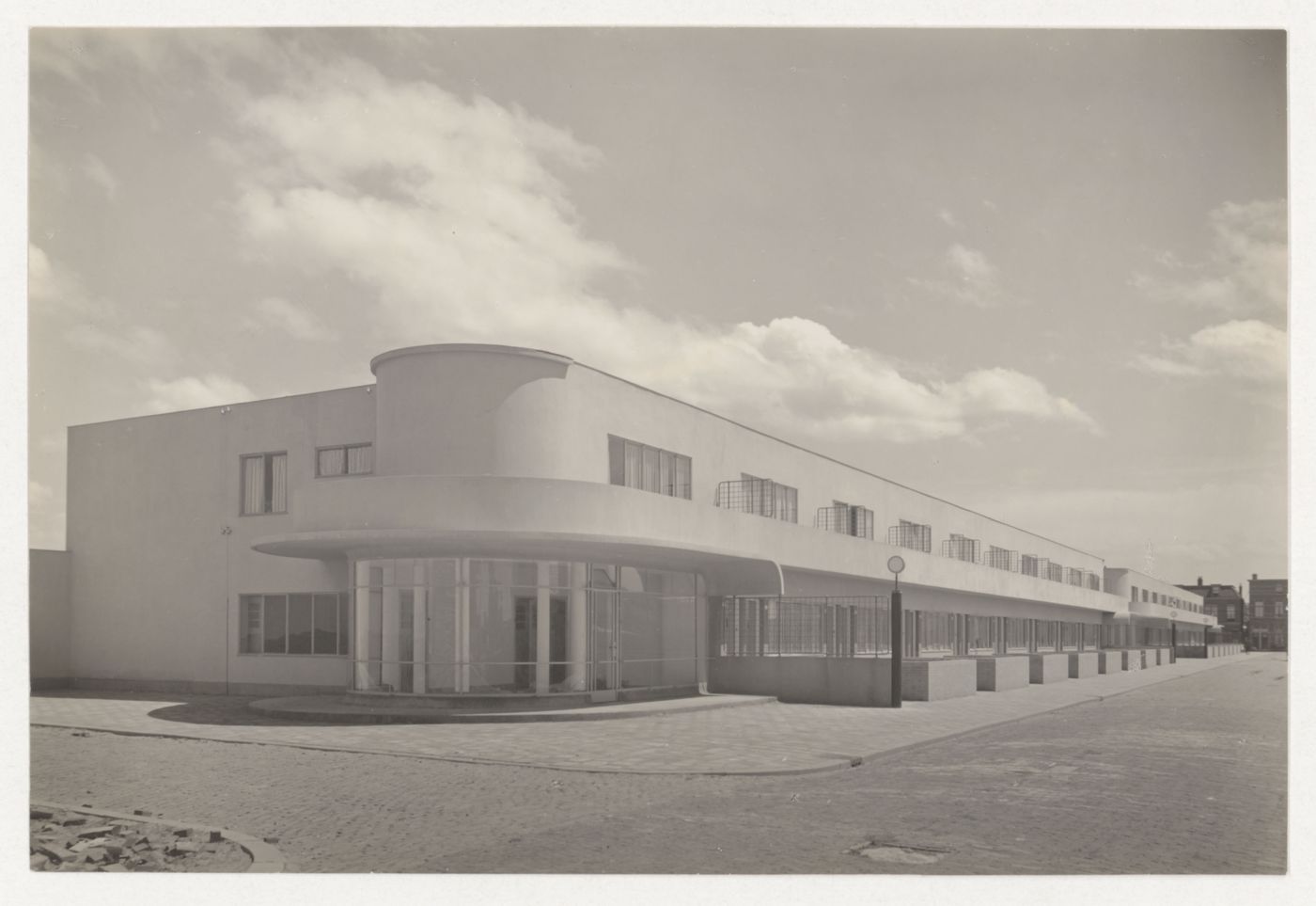 View of the principal façade of industrial row houses from across the street, Hoek van Holland, Netherlands