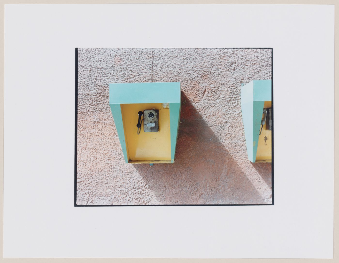 View of two coin-operated telephones mounted on a wall, Kaliningrad, Kaliningradskaia oblast', Russia (from the series "In between cities")