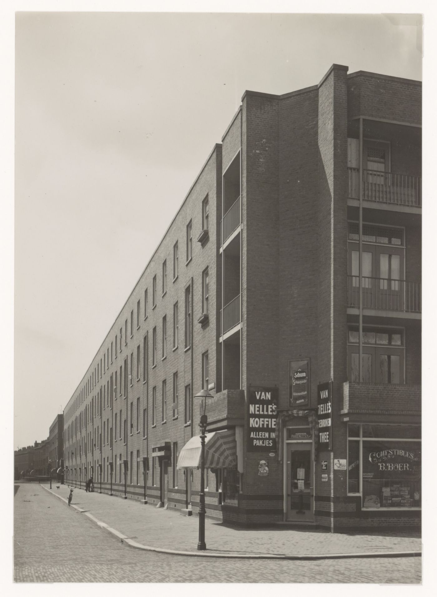 View of Tusschendijken Housing Estate showing the corner coffee shop, Rotterdam, Netherlands