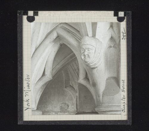 Detail of chapter house with sculpture of head, York Minster, York, North Yorkshire, England