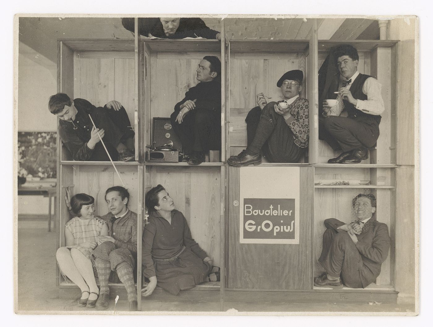 Group portrait of Walter Gropius and his students in Gropius' Bauhaus studio, Dessau, Germany
