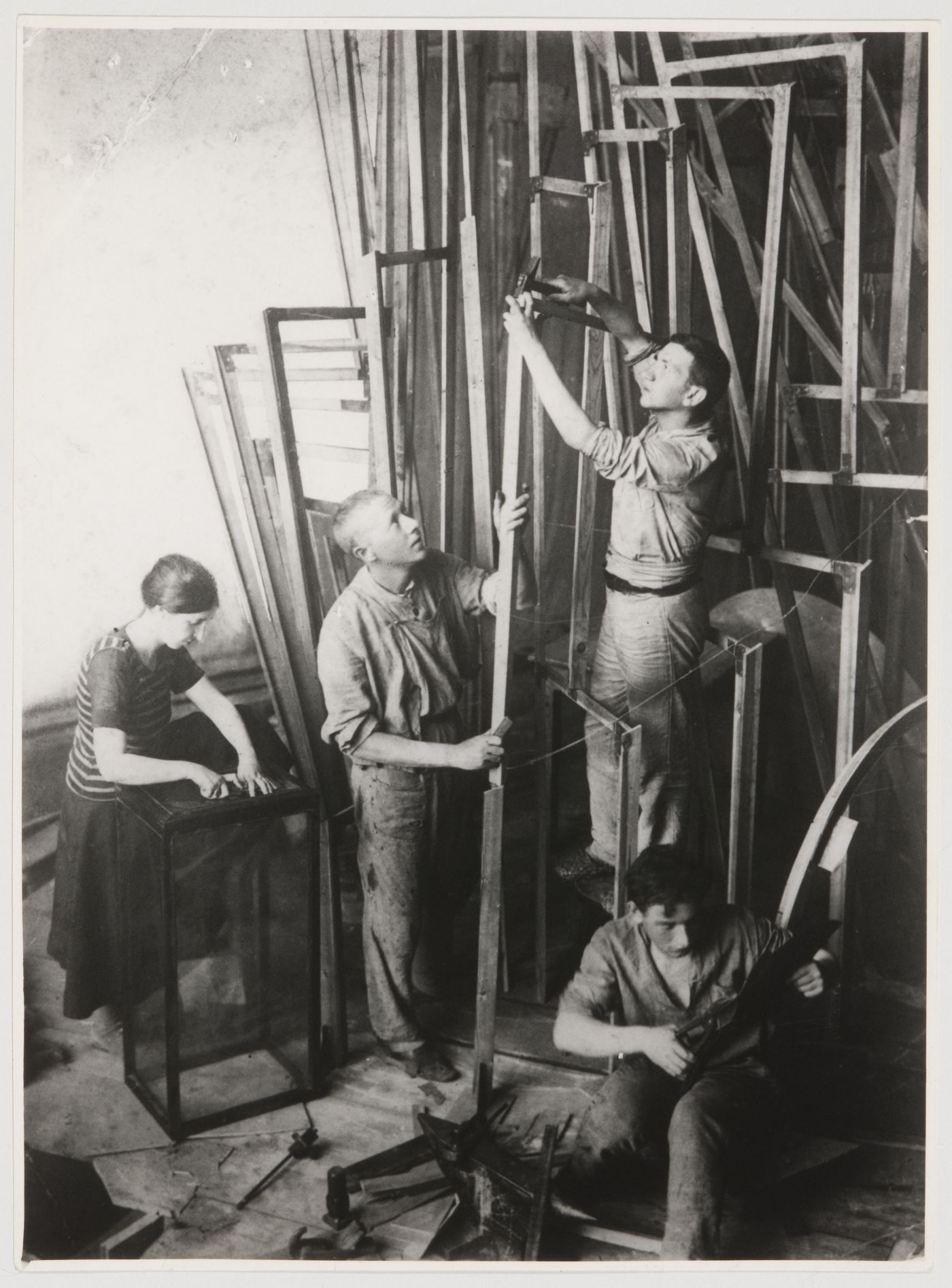 Vladimir Tatlin and his assistants S. Dymshits-Tolstaia, T.M. Shapiro and I.A. Meerzon constructing the first model for the monument to the Third International, Petrograd (now Saint Petersburg)
