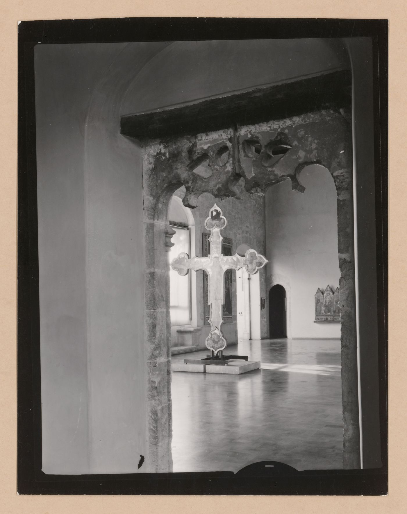 View of a doorway and gallery showing a freestanding painted crucifix, Palazzo Abatellis, Galleria regionale della Sicilia, Palermo, Italy