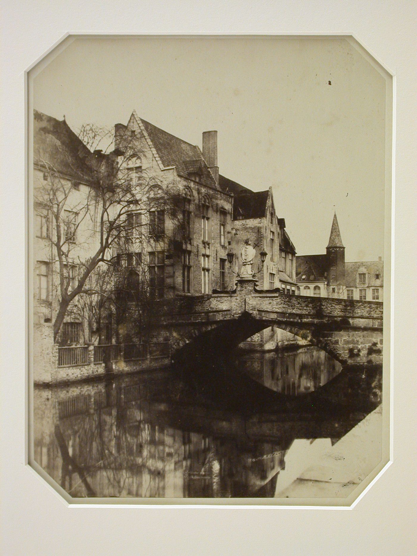 View of bridge of St. John Nepomuk, with houses, Bruges, Belgium