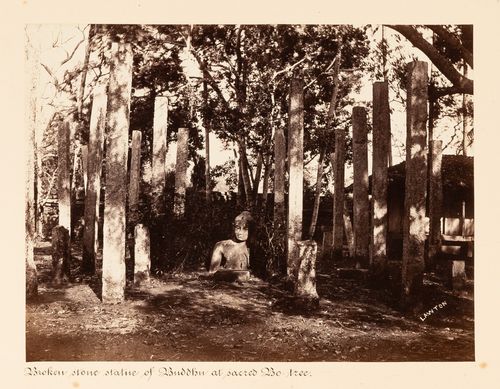 View of a statue of Buddha surrounded by columns, Bodhi Tree (also known as the Bo Tree) Enclosure, Anuradhapura, Ceylon (now Sri Lanka)