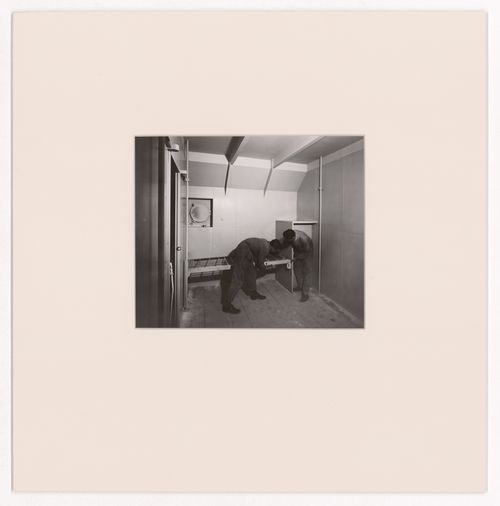 View of two men constructing an ocean liner cabin for the Otua, Salon d'automne, Paris, France