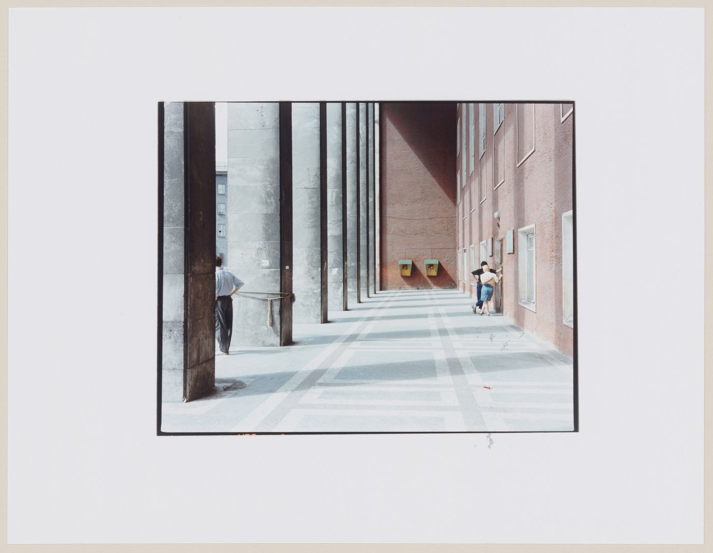 View of a portico showing columns and people, Kaliningrad, Kaliningradskaia oblast', Russia (from the series "In between cities")