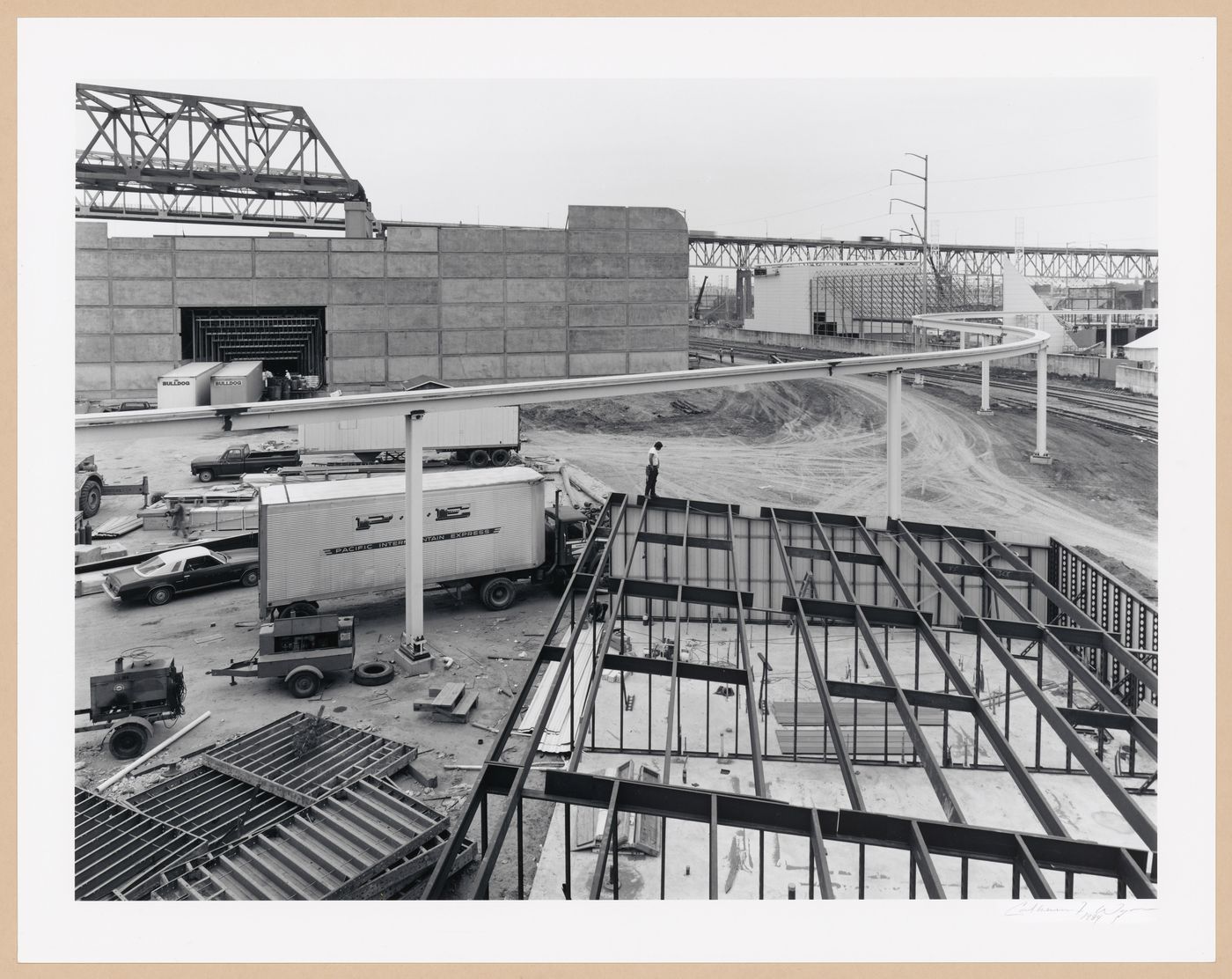 View of buildings and the Monorail track under construction, Louisiana World Exposition, New Orleans