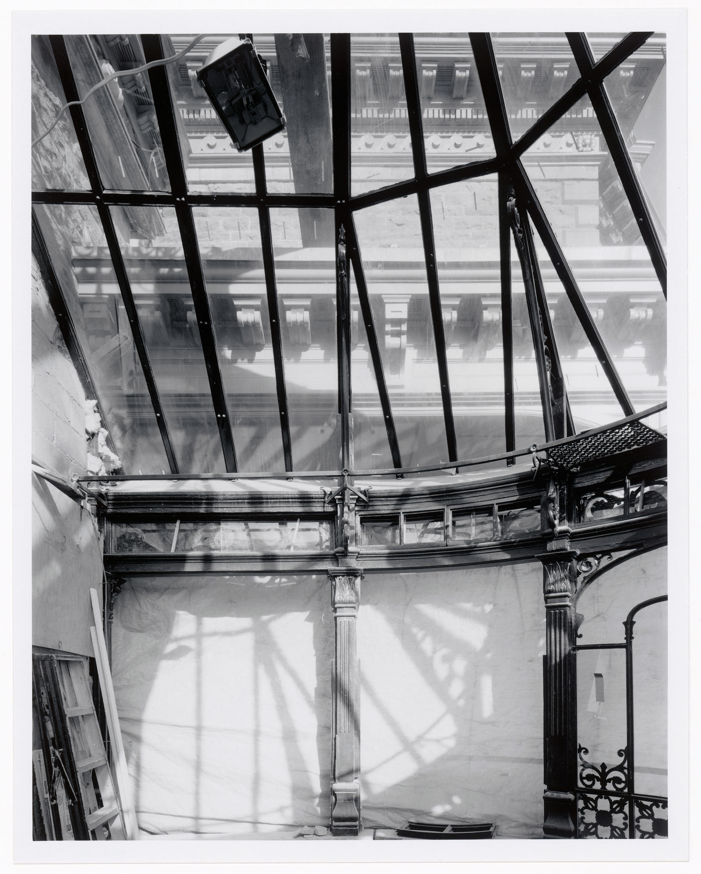 Interior view of the conservatory showing the glazed and ironwork ceiling, Shaughnessy House under renovation, Montréal, Québec