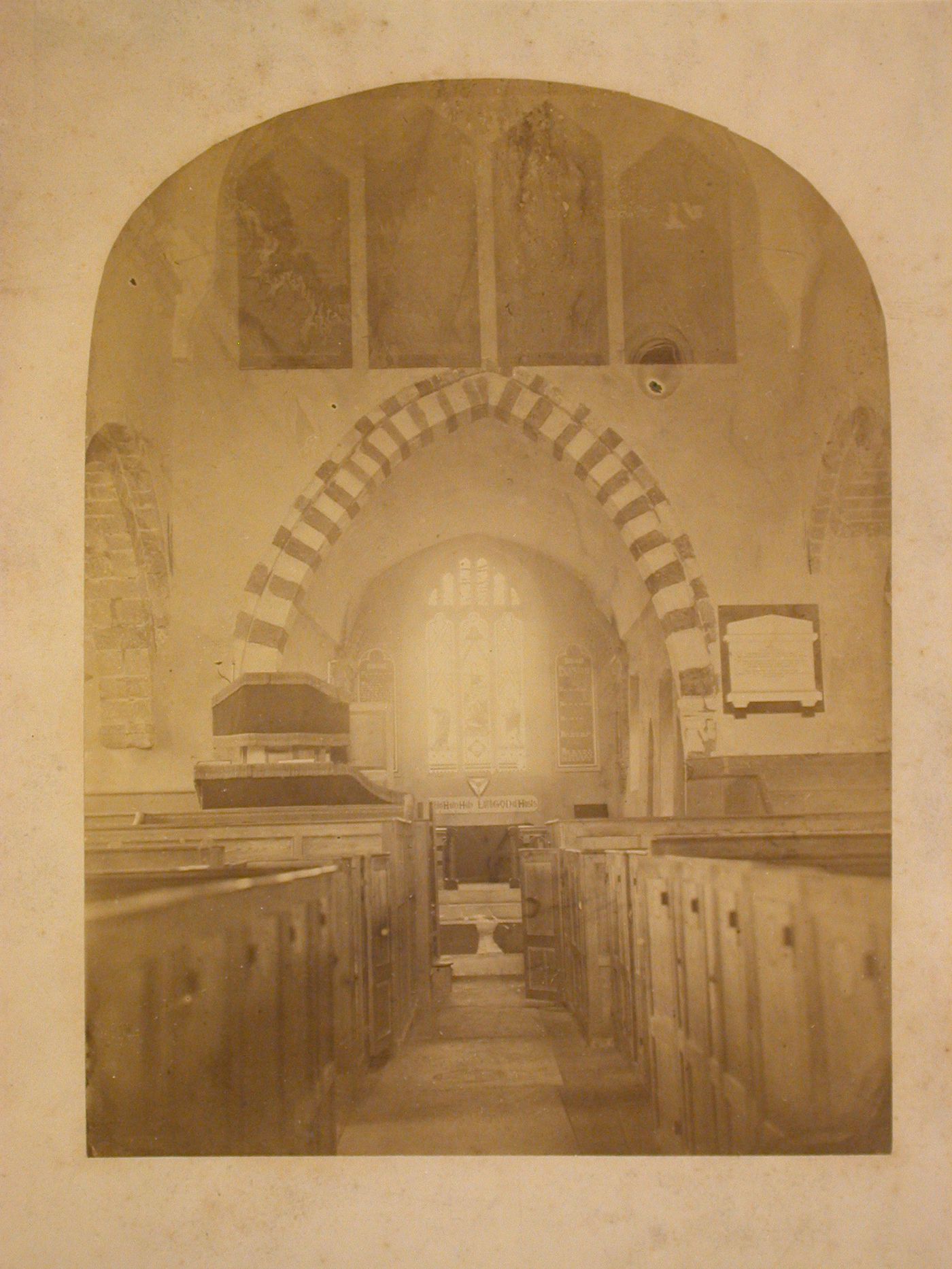 Interior view of the Church of All Saints showing the pews, pulpit and apse, Whiteparish, Wiltshire, England