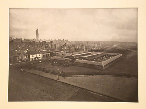 Distant view of enclosed clothes market, Glasgow in the background, Scotland